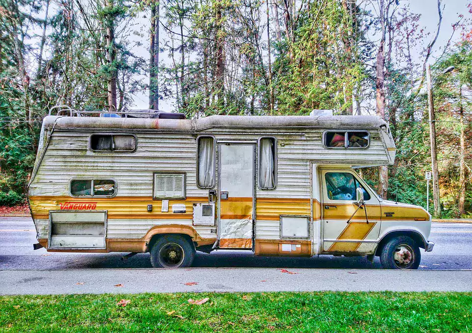 Vintage Vanguard Class C RV in need of maintenance.