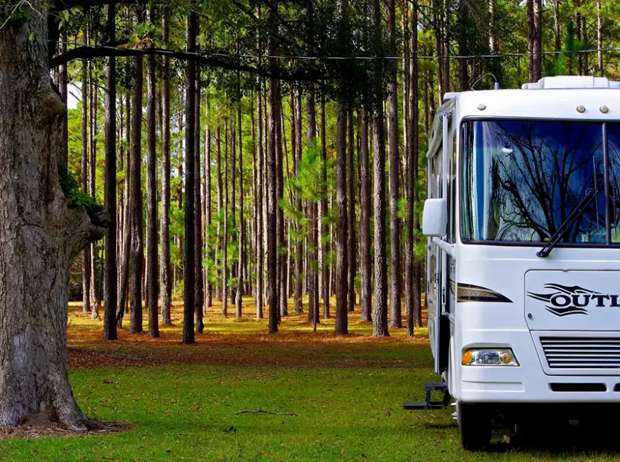 Outlaw Class A RV parked in the woods