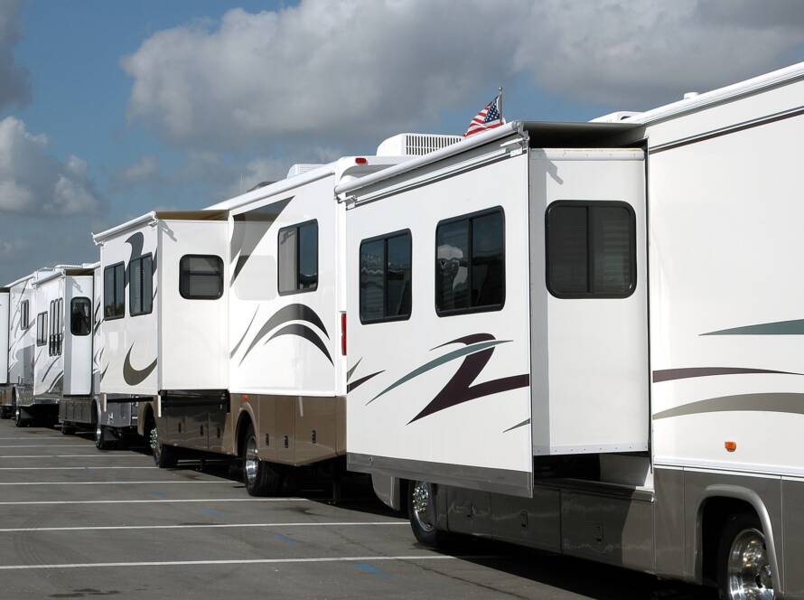 Row of Class A motorhomes with slideouts extended