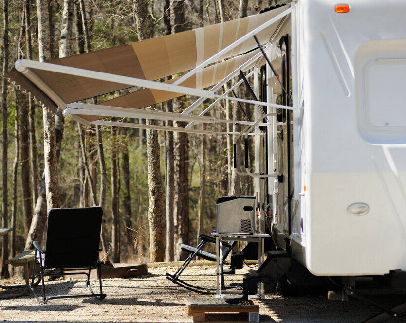 Looking under awning of recreational vehicle trailer.