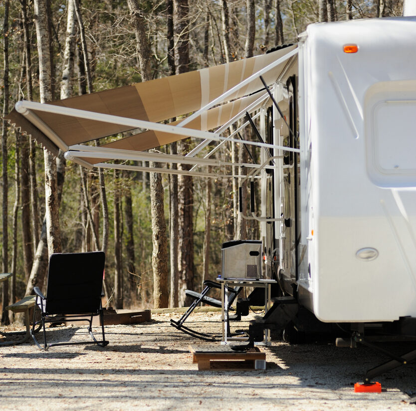Looking under awning of recreational vehicle trailer.